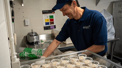 Volunteer preparing food.